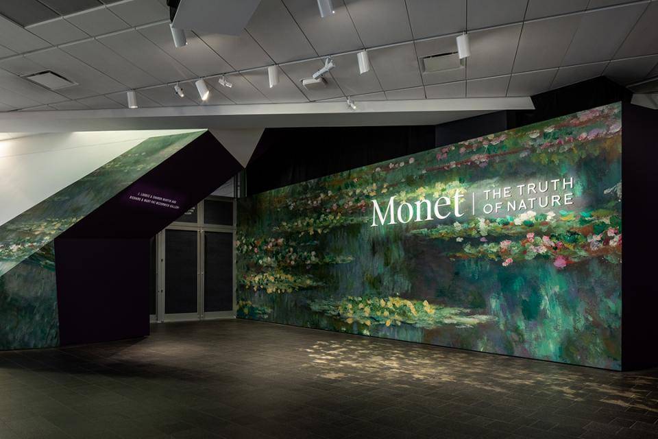 Entrance to the Monet Gallery at the Denver Art Museum. It shows his famous Water Lilies Painting and reads 'Monet | The Truth of Nature